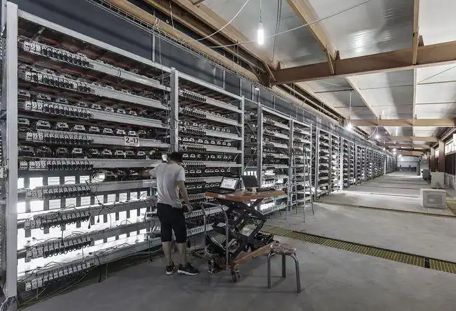 Multiple mining machines run inside a mining farm. Large amounts of electricity are needed to support the machines.
